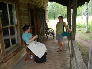 talking knitting with an interpreter at an early 20th century homesteader's cabin