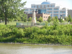 flood level obelisk from across the Red River of the North