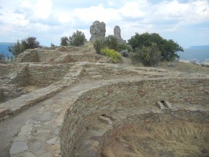 Great House Pueblo built by the Chaco people (kiva to lower right, Companion Rock and Chimney Rock in the background)