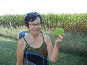 Amy with an Osage orange