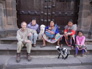 children in Cusco with a month-old alpaca and a week-old lamb