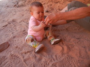 playing in the pink sand