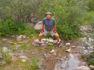 Dick at Divide Creek, which flows toward him then splits into two branches to the left and right